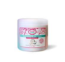 Load image into Gallery viewer, <p>Say goodbye to dull and lifeless hair with our new Coconut and Garlic Hair Mask!</p> <p>Packed with vitamin E, castor oil, and the nourishing benefits of coconut and garlic, this mask will revitalize your hair, reduce frizz, and promote growth.</p> <p>Say hello to healthy, luscious locks!</p>